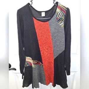 A This & That ladies color block sweater dress in a size medium.